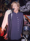 Buy Actress Kathleen Turner Singing with Her Husband's Band Named the Suits at the Harley Davidson Cafe at AllPosters.com