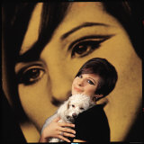 Singer and Actress Barbra Streisand Holding Small Dog in Her Arms