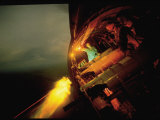 Crew of American AC47 Gunship Firing 7.62 MM Miniguns on a Night Mission During the Vietnam War