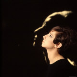 Singer and Actress Barbra Streisand in Front of Blow Up of Herself Also in Profile