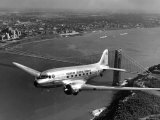 Buy Canadian Colonial Airways Passenger Plane Flys over George Washington Bridge in Montreal, Canada at AllPosters.com