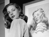 Buy Actress Lauren Bacall Posing in Front of Portrait Drawing of Herself in Suite at the Gotham Hotel at AllPosters.com