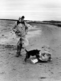 Buy Jackie Kennedy, Wife of Sen, Walking Along Beach with Her Slicker Clad Daughter Caroline at AllPosters.com