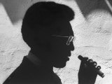 Silhouette of Actor/Comedian Bill Cosby with Cigar, Former Star of TV Series "I Spy"