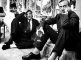Film Director Carol Reed and Author Graham Greene Sitting on the Floor with Wine Glasses