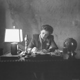 Actress Joan Fontaine Doing the Household Bookkeeping Next to Oscar Statuette