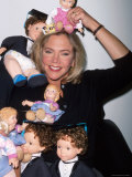 Buy Actress Kathleen Turner Posing with Dolls as Promotion for Her Film "Baby Geniuses" at AllPosters.com