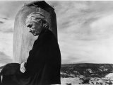Buy Portrait of Artist Georgia O'Keeffe Sitting on the Roof of Her Ghost Ranch Home at AllPosters.com