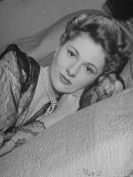 Buy Actress Joan Fontaine Wearing Sheer Negligee While Lounging on Bed at Home at AllPosters.com