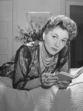 Buy Actress Joan Fontaine Wearing Sheer Negligee While Lounging on Bed at Home at AllPosters.com