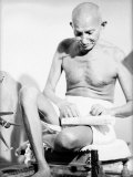 Indian Leader Mohandas Gandhi Reading as He Sits Cross Legged on Floor, at Home