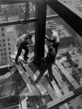 Workmen Attach Steel Beams Above Street During Construction of the Manhattan Company Building Photographic Print