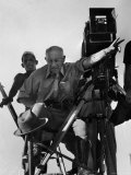 Cecil B. de Mille on Camera Stand in Desert While Directing Scenes from 