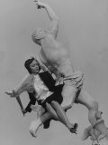 Actress Carolyn Jones Posing on Statue of Mercury