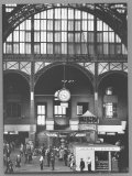 Buy Bustling Interior Showing Digital and Standard Clocks and Ironwork Arches of Penn Station at AllPosters.com
