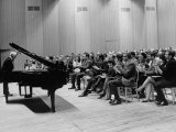 Pianist Artur Rubinstein Taking Bow Next to Grand Piano as Audience Enthusiastically Responds
