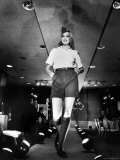 Model Jerry Hall Wearing Boy Scout Inspired Fashions by Designer Oscar de La Renta During a Show