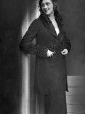 Woman Wearing German Designer Collared Woolen Dress Jacket Combination and Hat. 1920