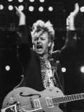 Guitarist for Stray Cats Rock Group Brian Setzer with Guitar, Screaming Song on Stage