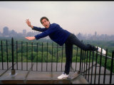 Comedian Jerry Seinfeld Acting Silly on His Apartment Building Rooftop Overlooking Central Park