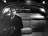 VP Richard Nixon Sitting Solemnly in Back Seat of Dimly Lit Limousine