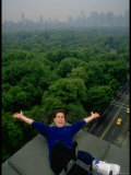 Comedian Jerry Seinfeld Perching Precariously on Roof Ledge Overlooking Central Park
