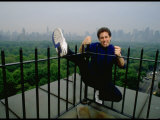 Comedian Jerry Seinfeld Perching Precariously on Roof Ledge Overlooking Central Park