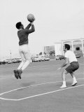 Buy Comedian Bill Cosby Shooting Ball Against His Press Agent, Joe Sutton, During Game of Basketball at AllPosters.com