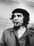 Buy Cuban Rebel Ernesto "Che" Guevara with Lit Cigar Clenched Between Teeth and Left Arm in a Sling at AllPosters.com