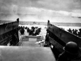 Small Landing Craft with American Soldiers Wading Ashore under Heavy German Fire