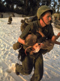 Buy US Marine Medic Running Along Beach with Injured Vietnamese Infant under Fire During Vietnam War at AllPosters.com