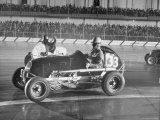Russ Klar Giving a Distress Signal by Raising His Hand as His Car Spins in a Midget Auto Race