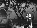 Mary Martin and Ezio Pinza Embracing in a Kiss During Stage Performance of South Pacific