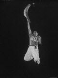 Mexican Jai Alai Player Segundo Jumping to Reach Pelota in Game at Hippodrome