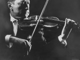 Buy Close Up of Violinist Jascha Heifetz Playing in Mili's Darkened Studio at AllPosters.com