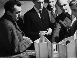 Theatrical Director Peter Glenville Looking over Graham Greene
