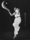 Mexican Jai Alai Player Segundo Jumping to Reach Pelota in Game at Hippodrome