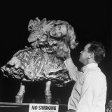 Movie Star Carmen Miranda Urges Man to Test Authenticity of Her Soft Tresses at a State Fair