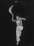 Mexican Jai Alai Player Segundo Jumping to Reach Pelota in Game at Hippodrome