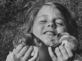 Shelley Silk, Daughter of Photographer George Silk, Ecstatically Cuddling Her Two Pet Hamsters