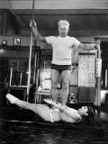 Opera Singer Roberta Peters Balancing Her Trainer, Joseph Pilates, on Her Operatic Breadbasket
