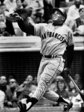 Baseball Player Willie Mays Watching Ball Clear Fence for Home Run in Game with Dodgers