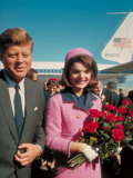 President John F. Kennedy Standing with Wife Jackie After Their Arrival at the Airport