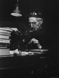 Irish Playwright Sean O'Casey with Pipe in His Mouth as He Works at His Typewriter at Home