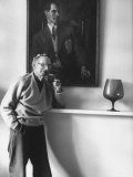 Irish Playwright Sean O'Casey Smoking Pipe with Painted Portrait Above Him Done by Augustus John