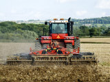 4 Wheel Drive Tractor Pulling a Disc Harrow, Cotswolds, England
