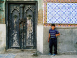 Boy Standing Near Door of Historic House, Baghdad, Iraq
