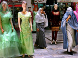 Two Afghan Woman Walk Next to Mannequins at a Women's Gallery Downtown Kabul