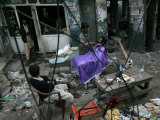 A Pakistani Barber Gives a Haircut and Beard Trim to a Customer