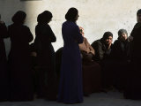 Palestinian Women Sit as They Mourn During the Funeral of Four Al-Aqsa Martyrs' Brigades Militants